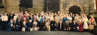 A group of people posing for camera
