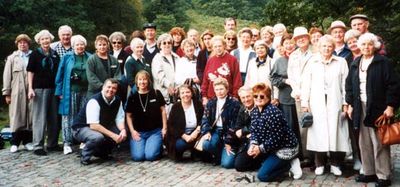 A group of people posing for camera